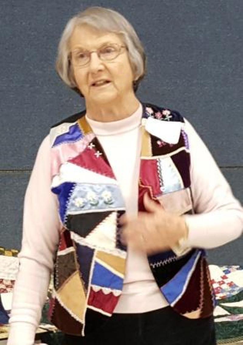 Eileen shows her vest, one of the first, of 20, quilt-a-thon projects with her daughters